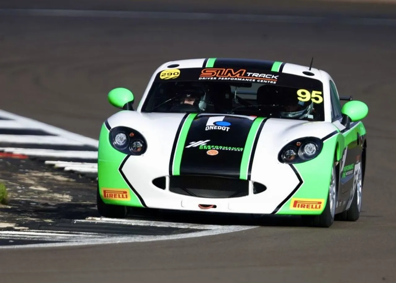 Noah Young's number 95 Ginetta in white and green livery cornering on track