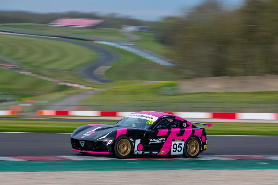 Noah Young's number 95 Ginetta G40 at speed during a Ginetta Junior race